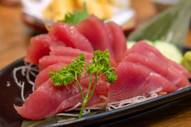 istock Tuna sashimi with vegetable on plate, served in a restaurant 1501159043