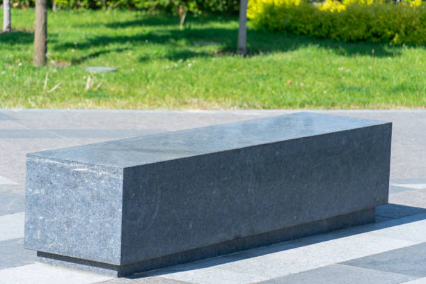 istock Comfortable stone bench in city park. 1501160070