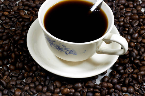 top view of  coffee grains and a cup from coffee