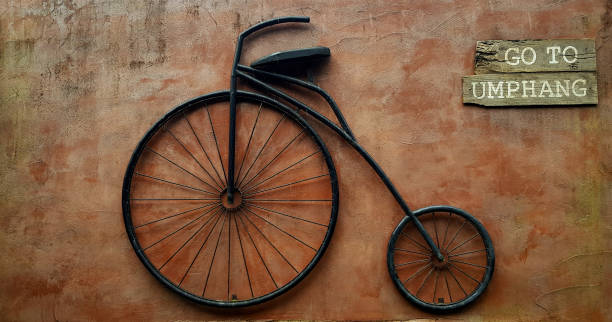 istock Vintage bicycle hanging on brown rough wall. 1501170821