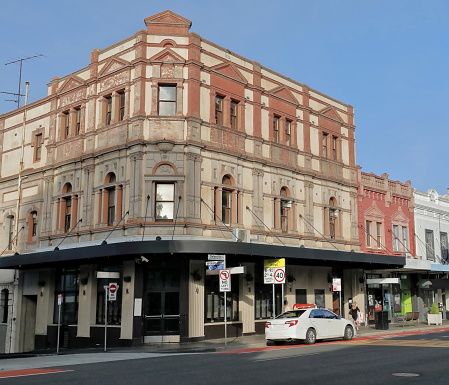 Three storey corner building from AD 1896-late Victorian era, blend of Classic Revival and Italianate styles, 3 facade bays to Oxford St.and 2 to William St., Paddington suburb. Sydney-NSW-Australia.