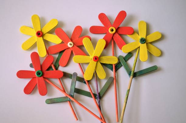 istock DIY Art and craft colourful popsicles sticks painted in different colors and make into beautiful flowers.  Satisfying. Hobby creativity kindergarten 1501177467