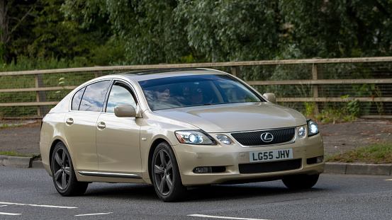 Milton Keynes,UK - June 24th 2023. 2005 beige LEXUS GS300 travelling on an English country road