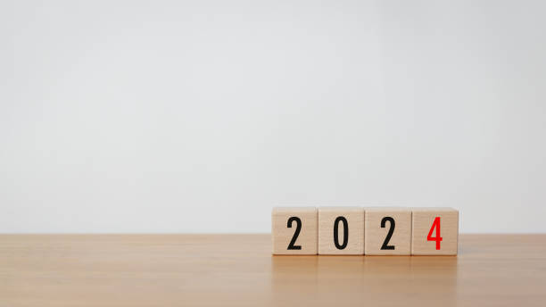 istock Wood cube block with 2024 text on wooden table with white background 1501181674