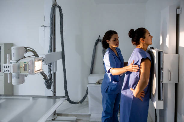 Radiologist getting a patient ready for an x-ray