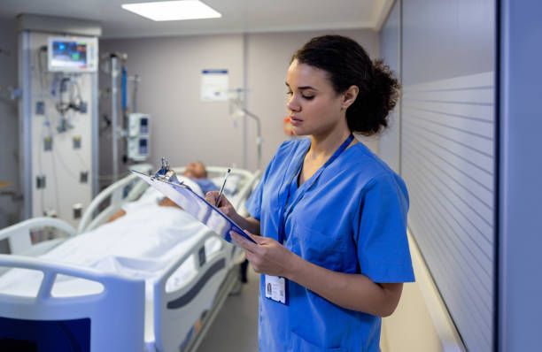 istock Nurse checking on a patient at the ICU 1501183941