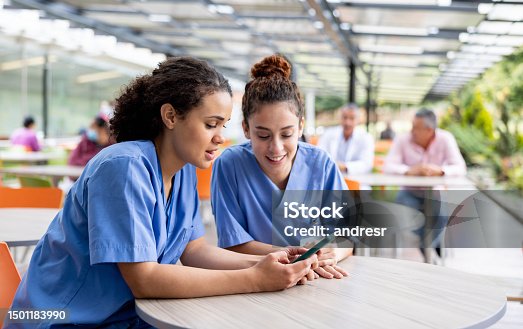istock Nurses taking a break and looking at social media at the cafeteria 1501183990