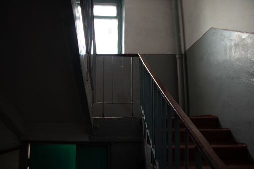old soviet dirty dark staircase in an apartment building in dnipro city in ukraine