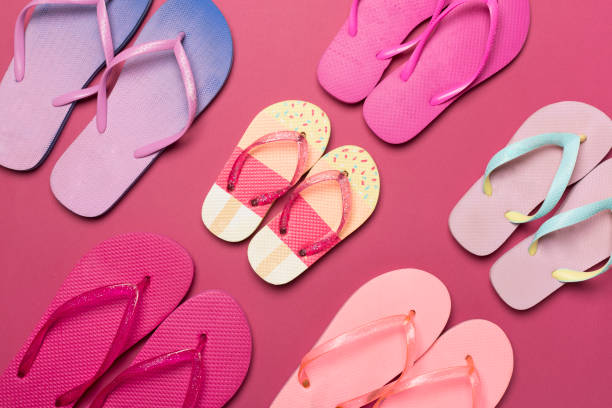 istock Many colorful flip flops on color background, top view 1501184200