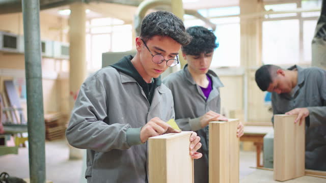 Carpentry Workshop With Students Studying For Apprenticeship At High School