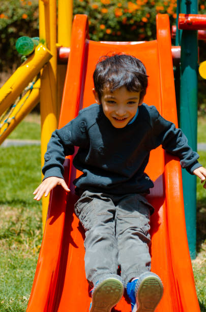 istock little kid playing in the playground and copy space 1501188558
