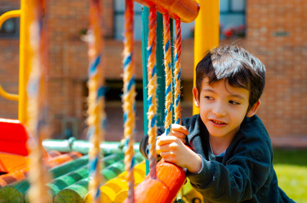little kid playing in the playground and copy space
