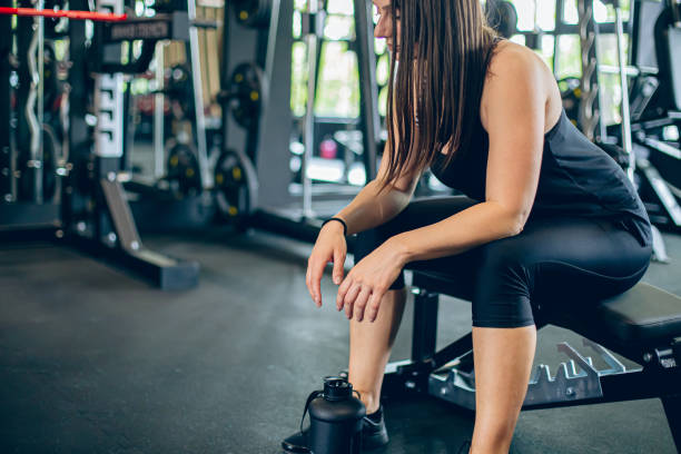 istock Young woman resting after workout at gym 1501189815