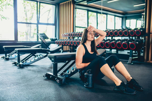 istock Young woman resting after workout at gym 1501189958