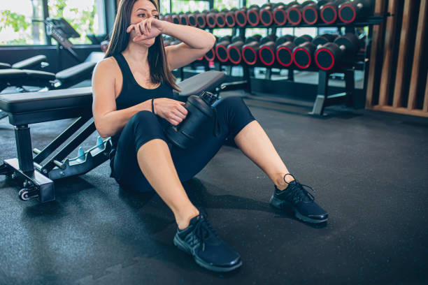 istock Young woman resting after workout at gym 1501190311