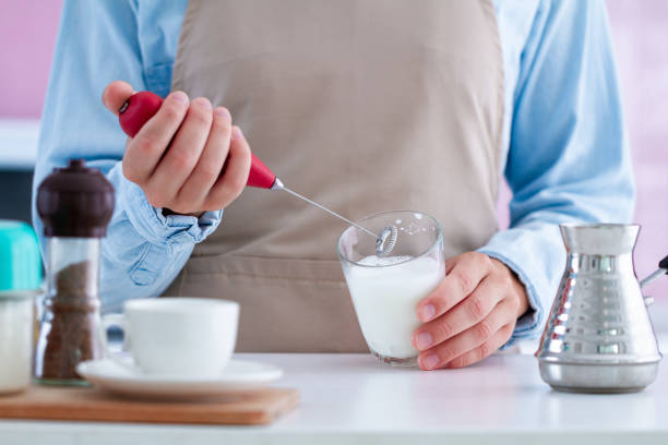 istock Using a milk frother for making aromatic coffee at home 1501193168