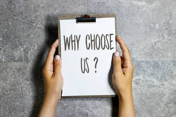 istock hands holding a clipboard with why choose us ? question concept on gray grunge marble background 1501193449