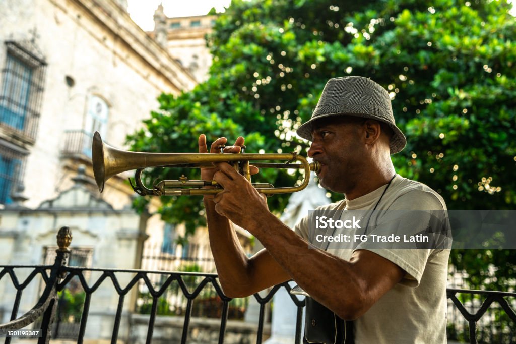 Mature man playing the trumpet on the streets of Havana, Cuba Cuba Stock Photo