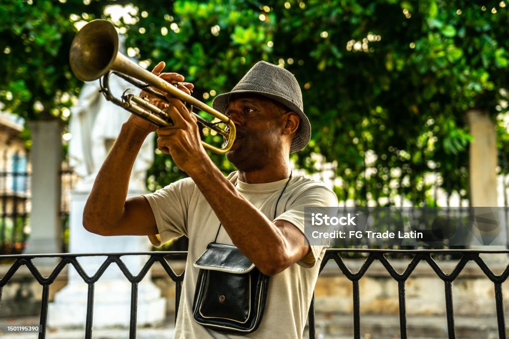 Mature man playing the trumpet on the streets of Havana, Cuba 50-54 Years Stock Photo
