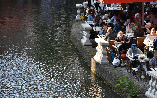 Utrecht, The Netherlands - June 8, 2023: Utrecht City Canal, People Sitting Down, Eating And Drinking In A Restaurant Scene During Springtime