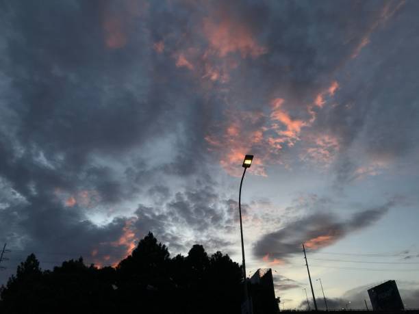 istock Street light illuminated against a pink and grey sky 1501204246