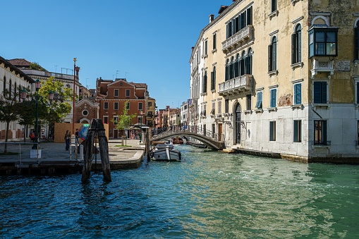 Venice, Italy – September 19, 2022: A peaceful river view of the traditional Venetian architecture in Italy