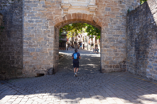 Pamplona, Spain - July, 31: Arriving through the medieval French Gate, in Spanish Portal de Francia