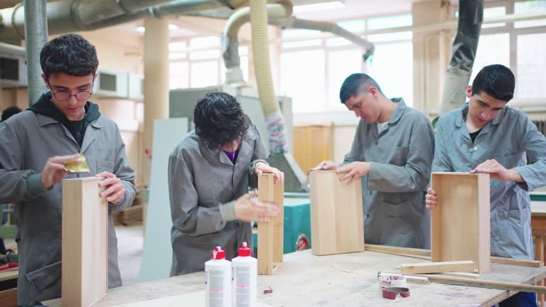 Carpentry Workshop With Students Studying For Apprenticeship At High School