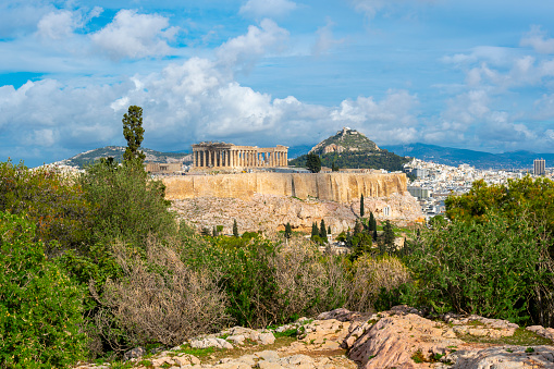 Athens, Greece, the ancient Parthenon temple on the Acropolis hill seen from the Acropolis Museum
