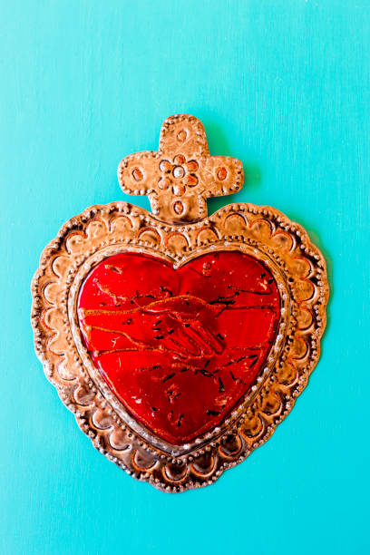 Red Tin Milagros Heart on Turquoise Background