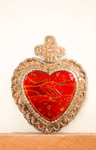 istock Red Tin Milagros Heart on White Background 1501242983