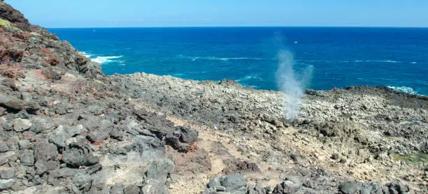 Photo of Dragons nostrils blowhole spewing seawater at the popular Makapuu tidepools on the north shore of Oahu Hawaii United States