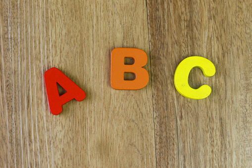 ABC - children's alphabet learning set on the wooden background