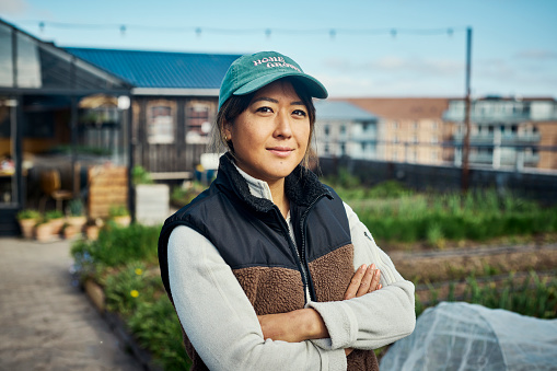 Portrait of an urban farmer on a rooftop farm.