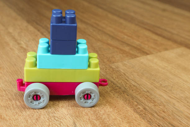 istock Plastic building blocks form vehicle on wooden background 1501249781