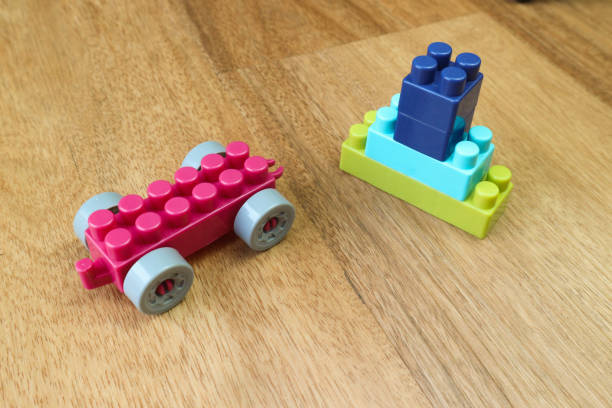 istock Plastic building blocks on wooden background 1501249797