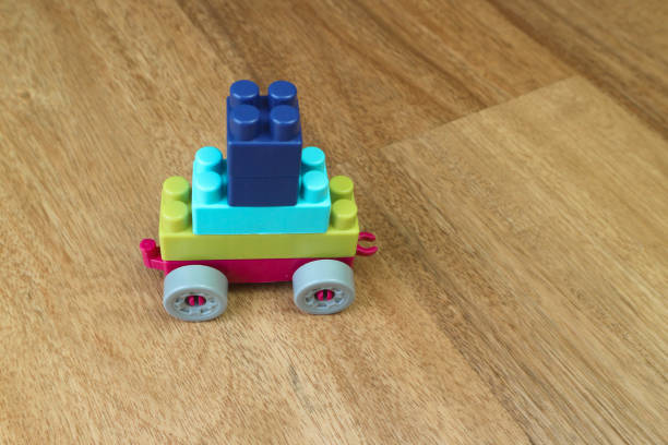 istock Plastic building blocks form vehicle on wooden background 1501250438