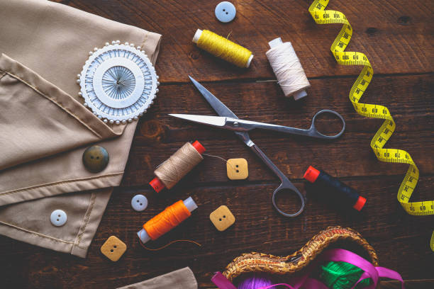 istock Sewing kit for needlework on wooden background. Top view 1501250719