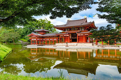 Japan - July, 2022 : Scenic view of Main Phoenix Hall of Byodoin Temple in Summer, One of most famous tourist destination in  Uji, Kyoto