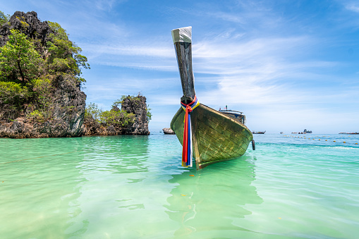 views of famous longtail boats used to move between island in krabi province, tahiland