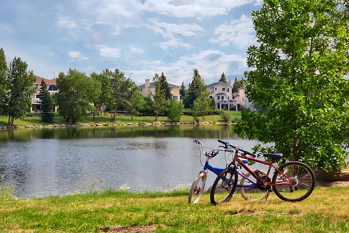 Two bicycles parked by the lake