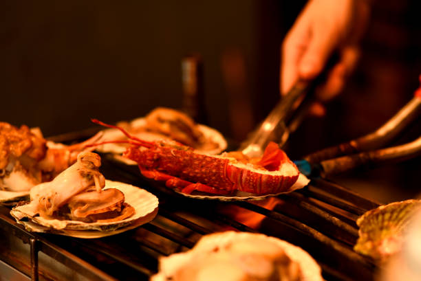 Scenery of grilling spiny lobster (with scallops)