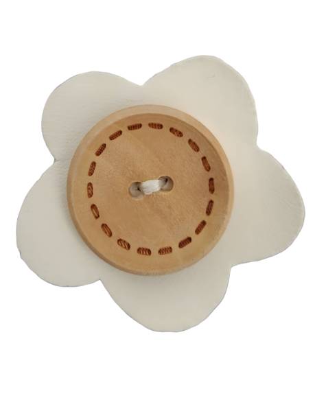 Daisy-shaped buttons with a leather texture isolated on white background.