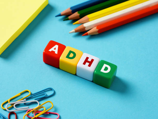 istock Attention deficit hyperactivity disorder ADHD concept. The abbreviation ADHD on colorful cubes with stationery objects 1501389427
