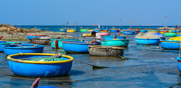 Bamboo basket boats docking at fishing village in Phan Thiet, Vietnam.