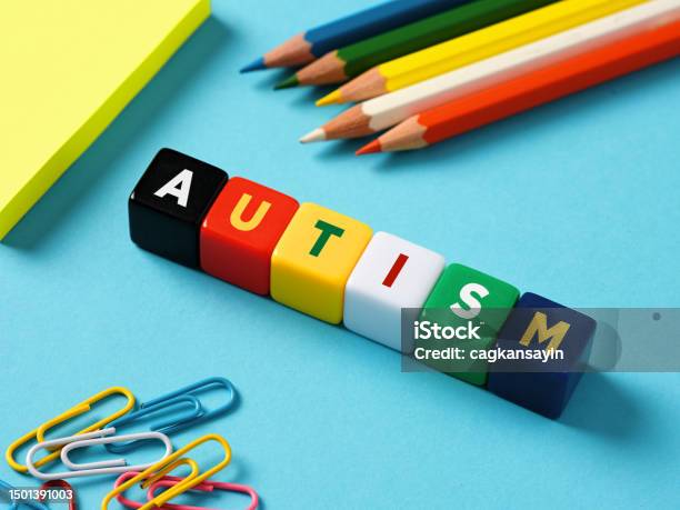 Autism And Education Concept Autism Spectrum Disorder The Word Autism On Colorful Cubes Stock Photo - Download Image Now