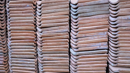 The neat arrangement of clay tiles for roofs forms a unique pattern, nice and cool