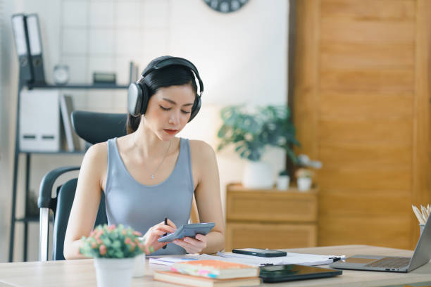 istock The millennial Asian young businesswoman is making notes for a business plan on her notebook, focusing on business analysis and strategy concepts. 1501428323