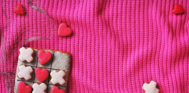 istock Pink background with gingerbread hearts. Love Wallpaper 1501443503
