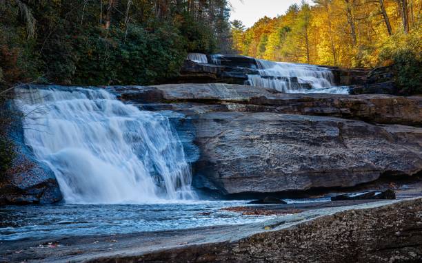 istock Majestic waterfall cascading into a serene lake in a lush forest setting 1501450491